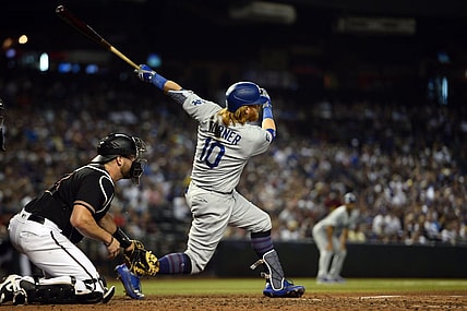 Jun 19, 2021; Phoenix, Arizona, USA; Los Angeles Dodgers third baseman Justin Turner (10) hits three RBI double against the Arizona Diamondbacks during the sixth inning at Chase Field. Mandatory Credit: Joe Camporeale-USA TODAY Sports