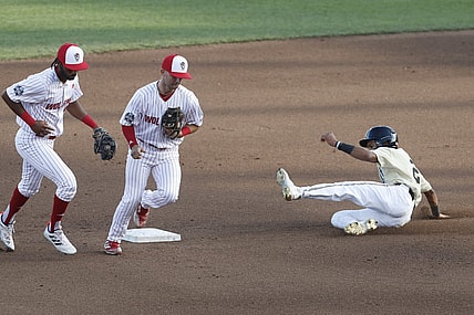 Jun 21, 2021; Omaha, Nebraska, USA;  NC State Wolfpack second baseman J.T. Jarrett (15) tags out Vanderbilt Commodores left fielder Javier Vaz (2) at TD Ameritrade Park. Mandatory Credit: Bruce Thorson-USA TODAY Sports