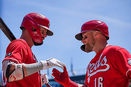Jun 22, 2021; Minneapolis, Minnesota, USA; Cincinnati Reds catcher Tucker Barnhart (16) celebrates his home run with designated hitter Jesse Winker (33) against the Minnesota Twins in the third inning at Target Field. Mandatory Credit: Brad Rempel-USA TODAY Sports