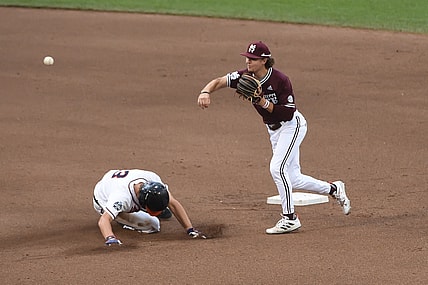 Jun 22, 2021; Omaha, Nebraska, USA; Mississippi State Bulldogs infielder Lane Forsythe (43) completes a double play in the fourth inning against the Virginia Cavaliers at TD Ameritrade Park. Mandatory Credit: Steven Branscombe-USA TODAY Sports