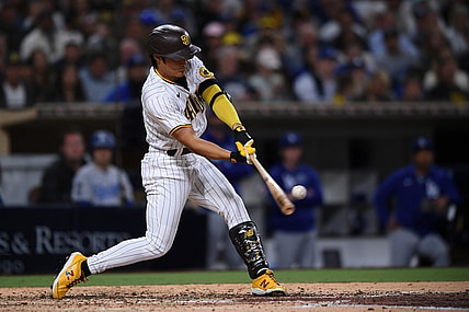 Jun 22, 2021; San Diego, California, USA; San Diego Padres pinch hitter Ha-seong Kim (7) hits a home run against the Los Angeles Dodgers during the fifth inning at Petco Park. Mandatory Credit: Orlando Ramirez-USA TODAY Sports