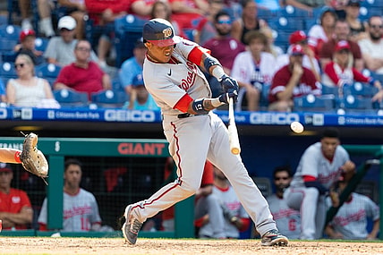 Jun 23, 2021; Philadelphia, Pennsylvania, USA; Washington Nationals second baseman Starlin Castro (13) hits a two RBI single during the ninth inning against the Philadelphia Phillies at Citizens Bank Park. Mandatory Credit: Bill Streicher-USA TODAY Sports