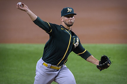 Jun 23, 2021; Arlington, Texas, USA; Oakland Athletics starting pitcher James Kaprielian (32) pitches against the Texas Rangers during the first inning at Globe Life Field. Mandatory Credit: Jerome Miron-USA TODAY Sports
