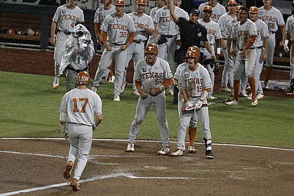 Jun 25, 2021; Omaha, Nebraska, USA;  Texas Longhorns designated hitter Ivan Melendez (17) scores after hitting a three-run home run against the Mississippi State Bulldogs at TD Ameritrade Park. Mandatory Credit: Bruce Thorson-USA TODAY Sports