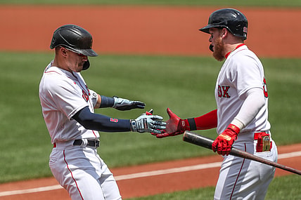 Jun 27, 2021; Boston, Massachusetts, USA; Boston Red Sox center fielder Enrique Hernandez (5) celebrates with Boston Red Sox left fielder Alex Verdugo (99) after hitting a home run during the first inning against the New York Yankees at Fenway Park. Mandatory Credit: Paul Rutherford-USA TODAY Sports