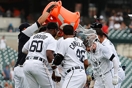 Jun 27, 2021; Detroit, Michigan, USA;  Detroit Tigers left fielder Robbie Grossman (8) is congratulated by teammates after he bunts in the winning run tenth inning against the Houston Astros at Comerica Park. Mandatory Credit: Rick Osentoski-USA TODAY Sports