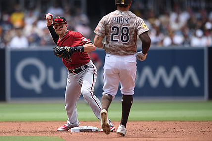 Jun 27, 2021; San Diego, California, USA; Arizona Diamondbacks shortstop Nick Ahmed (13) forces out San Diego Padres left fielder Tommy Pham (28) at second base before throwing to first base during the third inning at Petco Park. Mandatory Credit: Orlando Ramirez-USA TODAY Sports