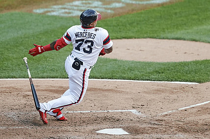 Jun 27, 2021; Chicago, Illinois, USA; Chicago White Sox catcher Yermin Mercedes (73) hits an RBI single against the Seattle Mariners during the fourth inning of the second game of a doubleheader at Guaranteed Rate Field. Mandatory Credit: Kamil Krzaczynski-USA TODAY Sports
