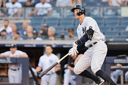 Jun 28, 2021; Bronx, New York, USA; New York Yankees right fielder Aaron Judge (99) hits an RBI double during the first inning against the Los Angeles Angels at Yankee Stadium. Mandatory Credit: Vincent Carchietta-USA TODAY Sports