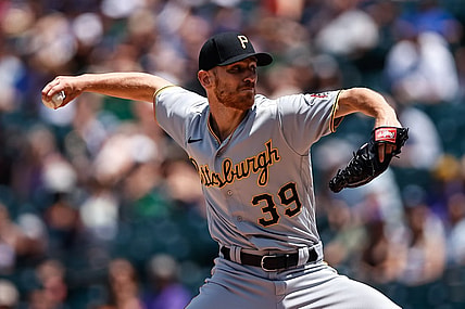 Jun 30, 2021; Denver, Colorado, USA; Pittsburgh Pirates starting pitcher Chad Kuhl (39) pitches in the first inning against the Colorado Rockies at Coors Field. Mandatory Credit: Isaiah J. Downing-USA TODAY Sports
