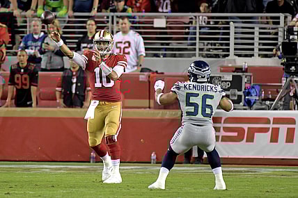 Nov 11, 2019; Santa Clara, CA, USA; San Francisco 49ers quarterback Jimmy Garoppolo (10) throws a pass over Seattle Seahawks linebacker Mychal Kendricks (56) during the first half at Levi's Stadium. Mandatory Credit: Kirby Lee-USA TODAY Sports