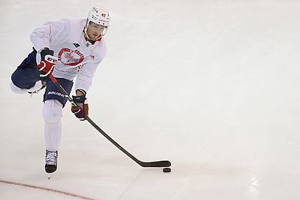 Jul 14, 2020; Arlington, Virginia, USA; Washington Capitals left wing Beck Malenstyn (47) shoots the puck during an NHL workout at MedStar Capitals Iceplex. Mandatory Credit: Geoff Burke-USA TODAY Sports