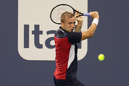 Mar 26, 2021; Miami, Florida, USA; Daniel Evans of Great Britain hits a backhand against Frances Tiafoe of the United States (not pictured) in the second round in the Miami Open at Hard Rock Stadium. Mandatory Credit: Geoff Burke-USA TODAY Sports