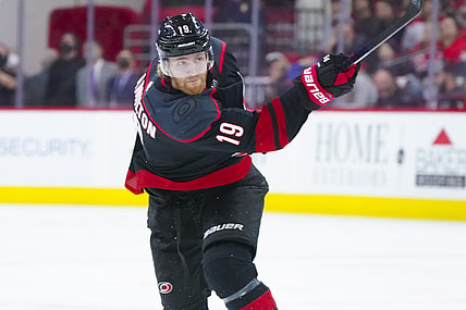 May 30, 2021; Raleigh, North Carolina, USA; Carolina Hurricanes defenseman Dougie Hamilton (19) takes a shot against the Tampa Bay Lightning in game one of the second round of the 2021 Stanley Cup Playoffs at PNC Arena. Mandatory Credit: James Guillory-USA TODAY Sports