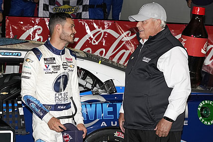 May 30, 2021; Concord, North Carolina, USA;  NASCAR Cup Series driver Kyle Larson (5) talks with team owner Rick Hendrick on his winning the Coca-Cola 600 at Charlotte Motor Speedway. Mandatory Credit: Jim Dedmon-USA TODAY Sports