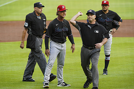 Jul 2, 2021; Atlanta, Georgia, USA; umpire Dan Iassogna (58) throws Miami Marlins manager Don Mattingly (8) out of a game against the Atlanta Braves in the first inning at Truist Park. Mandatory Credit: Brett Davis-USA TODAY Sports
