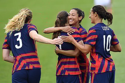 Jul 5, 2021; East Hartford, Connecticut, USA;  United States forward Tobin Heath (7) and United States forward Carli Lloyd (10) and United States midfielder Sam Mewis (3) celebrate the goal by the United States forward Christen Press (11) against the Mexico during the first half during a USWNT Send-off Series soccer match at Pratt & Whitney Stadium. Mandatory Credit: Dennis Schneidler-USA TODAY Sports