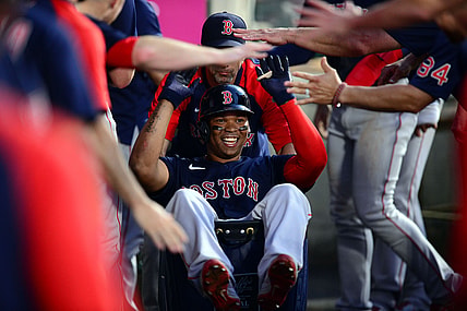 Jul 5, 2021; Anaheim, California, USA; Boston Red Sox third baseman Rafael Devers (11) celebrates his two run home run hit against the Los Angeles Angels during the fourth inning at Angel Stadium. Mandatory Credit: Gary A. Vasquez-USA TODAY Sports