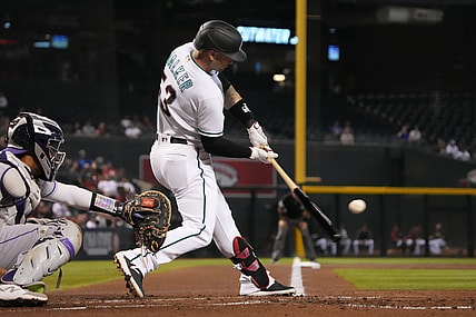 Jul 6, 2021; Phoenix, Arizona, USA; Arizona Diamondbacks first baseman Christian Walker (53) hits an RBI double against the Colorado Rockies in the first inning at Chase Field. Mandatory Credit: Rick Scuteri-USA TODAY Sports
