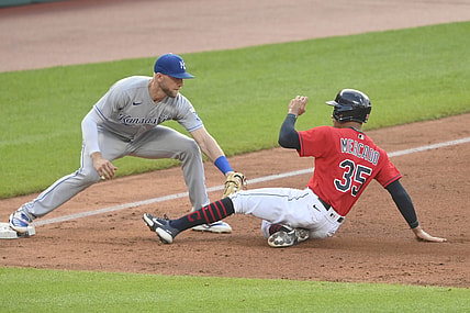 Jul 8, 2021; Cleveland, Ohio, USA; Kansas City Royals third baseman Hunter Dozier (17) tags Cleveland Indians left fielder Oscar Mercado (35) to complete a double play in the third inning at Progressive Field. Mandatory Credit: David Richard-USA TODAY Sports