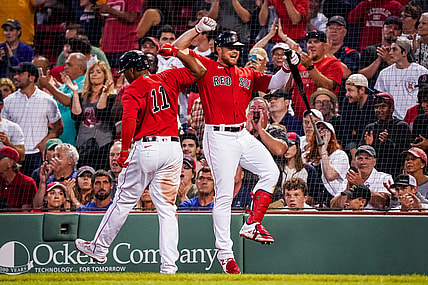 Jul 9, 2021; Boston, Massachusetts, USA; Boston Red Sox third baseman Rafael Devers (11) is congratulated after hitting a home run against the Philadelphia Phillies in the third inning at Fenway Park. Mandatory Credit: David Butler II-USA TODAY Sports