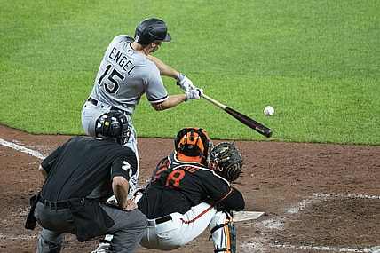 Jul 9, 2021; Baltimore, Maryland, USA; Chicago White Sox center fielder Adam Engel (15) hits a sacrifice fly during the sixth inning against the Baltimore Orioles at Oriole Park at Camden Yards. Mandatory Credit: Gregory Fisher-USA TODAY Sports