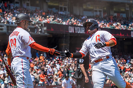 Jul 10, 2021; San Francisco, California, USA;  San Francisco Giants second baseman Donovan Solano (7) celebrates with left fielder Thairo Estrada (39) after scoring a run against the Washington Nationals in the third inning at Oracle Park. Mandatory Credit: John Hefti-USA TODAY Sports