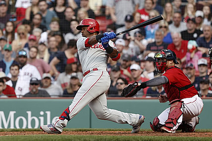 Jul 10, 2021; Boston, Massachusetts, USA; Philadelphia Phillies shortstop Jean Segura (2) hits a two run single against the Boston Red Sox during the eighth inning at Fenway Park. Mandatory Credit: Winslow Townson-USA TODAY Sports