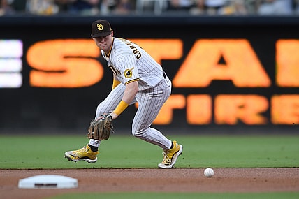 Jul 10, 2021; San Diego, California, USA; San Diego Padres second baseman Jake Cronenworth (9) fields a ground ball hit for a single by Colorado Rockies left fielder Raimel Tapia (not pictured) during the first inning at Petco Park. Mandatory Credit: Orlando Ramirez-USA TODAY Sports