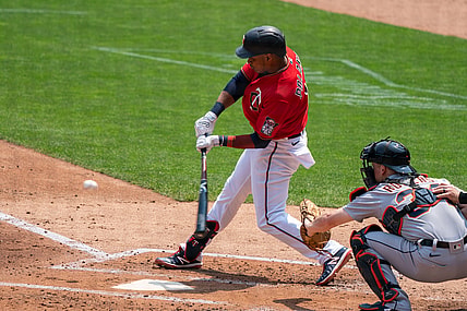 Jul 11, 2021; Minneapolis, Minnesota, USA; Minnesota Twins second baseman Jorge Polanco (11) hits a single during the second inning against the Detroit Tigers at Target Field. Mandatory Credit: Jordan Johnson-USA TODAY Sports