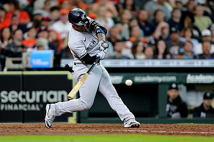 Jul 11, 2021; Houston, Texas, USA; New York Yankees shortstop Gleyber Torres (25) hits an RBI single to center field against the Houston Astros during the fifth inning at Minute Maid Park. Mandatory Credit: Erik Williams-USA TODAY Sports