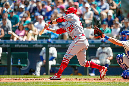 Jul 11, 2021; Seattle, Washington, USA; Los Angeles Angels second baseman David Fletcher (22) hits a two-run RBI single against the Seattle Mariners during the fifth inning at T-Mobile Park. Mandatory Credit: Jennifer Buchanan-USA TODAY Sports