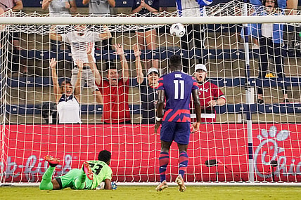 Jul 15, 2021; Kansas City, Kansas, USA; United States forward Daryl Dike (11) scores a goal as Martinique goalkeeper Meslien Gilles (23) looks on during CONCACAF Gold Cup Soccer group stage play at Children's Mercy Park. Mandatory Credit: Denny Medley-USA TODAY Sports