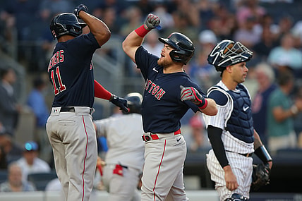 Jul 16, 2021; Bronx, New York, USA; Boston Red Sox second baseman Christian Arroyo (39) celebrates his two run home run against the New York Yankees with third baseman Rafael Devers (11) during the second inning at Yankee Stadium. Mandatory Credit: Brad Penner-USA TODAY Sports