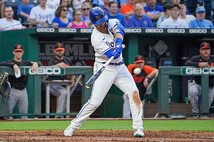 Jul 16, 2021; Kansas City, Missouri, USA; Kansas City Royals right fielder Whit Merrifield (15) hits a one-run sacrifice in the third inning against the Baltimore Orioles at Kauffman Stadium. Mandatory Credit: Denny Medley-USA TODAY Sports