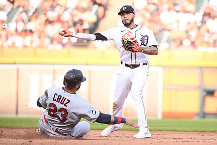 Jul 17, 2021; Detroit, Michigan, USA; Detroit Tigers second baseman Harold Castro (right) forces Minnesota Twins designated hitter Nelson Cruz (23) out at second base and throws to first base during the fifth inning at Comerica Park. Mandatory Credit: Tim Fuller-USA TODAY Sports