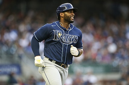 Jul 17, 2021; Atlanta, Georgia, USA; Tampa Bay Rays third baseman Yandy Diaz (2) hits a single against the Atlanta Braves in the fourth inning at Truist Park. Mandatory Credit: Brett Davis-USA TODAY Sports