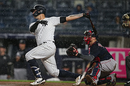 Jul 17, 2021; Bronx, New York, USA; New York Yankees catcher Gary Sanchez (24) follows through on a solo home run against the Boston Red Sox during the sixth inning at Yankee Stadium. Mandatory Credit: Brad Penner-USA TODAY Sports