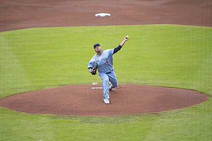Jul 18, 2021; Buffalo, New York, CAN; Toronto Blue Jays pitcher Hyun Jin Ryu (99) delivers a pitch during the first inning against the Texas Rangers at Sahlen Field. Mandatory Credit: Gregory Fisher-USA TODAY Sports