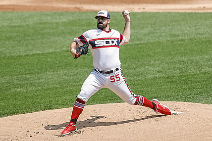 Jul 18, 2021; Chicago, Illinois, USA; Chicago White Sox starting pitcher Carlos Rodon (55) throws a pitch against the Houston Astros during the first inning at Guaranteed Rate Field. Mandatory Credit: Kamil Krzaczynski-USA TODAY Sports