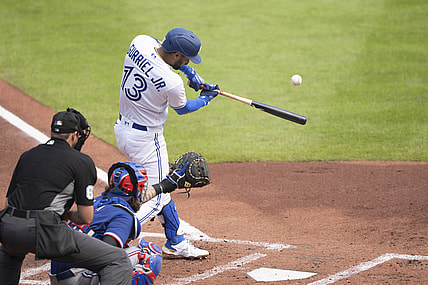 Jul 18, 2021; Buffalo, New York, CAN; Toronto Blue Jays left fielder Lourdes Gurriel Jr. (13) hits a grand slam home run during the first inning against the Texas Rangers at Sahlen Field. Mandatory Credit: Gregory Fisher-USA TODAY Sports