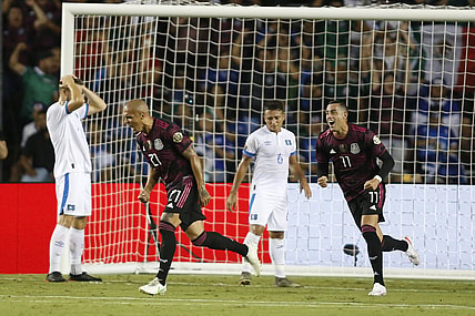 Jul 18, 2021; Dallas, Texas, USA; Mexico defender Luis Rodriguez (21) and forward Rogelio Funes Mori (11) celebrate a goal during the first half against the El Salvador during CONCACAF Gold Cup Soccer group stage play at Cotton Bowl. Mandatory Credit: Tim Heitman-USA TODAY Sports