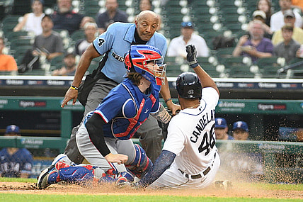Jul 19, 2021; Detroit, Michigan, USA; Texas Rangers catcher Jonah Heim (28) tags out Detroit Tigers designated hitter Jeimer Candelario (46) at home during the fourth inning at Comerica Park. Mandatory Credit: Tim Fuller-USA TODAY Sports