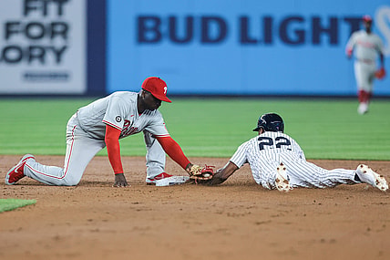 Jul 20, 2021; Bronx, New York, USA; New York Yankees left fielder Greg Allen (22) steals second base as Philadelphia Phillies shortstop Didi Gregorius (18) applies a late tag during the fifth inning at Yankee Stadium. Mandatory Credit: Vincent Carchietta-USA TODAY Sports