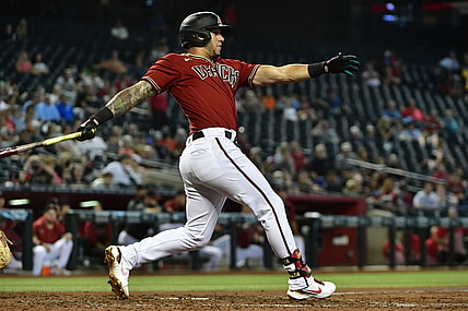 Jul 21, 2021; Phoenix, Arizona, USA;  Arizona Diamondbacks left fielder David Peralta (6) hits an RBI double in the third inning against the Pittsburgh Pirates at Chase Field. Mandatory Credit: Matt Kartozian-USA TODAY Sports