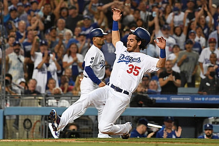 Jul 21, 2021; Los Angeles, California, USA;  Los Angeles Dodgers center fielder Cody Bellinger (35) runs home to score on a double hit by left fielder AJ Pollock (not pictured) in the fourth inning against the San Francisco Giants at Dodger Stadium. Mandatory Credit: Richard Mackson-USA TODAY Sports