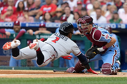 Jul 22, 2021; Philadelphia, Pennsylvania, USA; Atlanta Braves second baseman Ozzie Albies (1) slides into home past the tag attempt of Philadelphia Phillies catcher Andrew Knapp (5) for a run during the first inning at Citizens Bank Park. Mandatory Credit: Bill Streicher-USA TODAY Sports