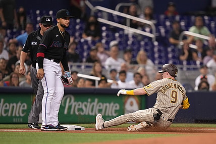 Jul 23, 2021; Miami, Florida, USA; San Diego Padres second baseman Jake Cronenworth (9) slides safely into third base for a triple in the 1st inning against the Miami Marlins at loanDepot park. Mandatory Credit: Jasen Vinlove-USA TODAY Sports