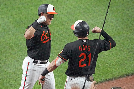 Jul 23, 2021; Baltimore, Maryland, USA; Baltimore Orioles second baseman Pat Valaika (11) is greeted by outfielder Austin Hays (21) following his fifth inning solo home run against the Washington Nationals at Oriole Park at Camden Yards. Mandatory Credit: Mitch Stringer-USA TODAY Sports