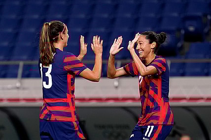 Jul 24, 2021; Saitama, Japan; United States forward Christen Press (11) celebrates her goal against New Zealand with forward Alex Morgan (13) during the second half in group G play during the Tokyo 2020 Olympic Summer Games at Saitama Stadium. Mandatory Credit: Jack Gruber-USA TODAY Network